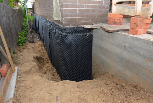 Happy homeowners after waterproofing job in Elgin